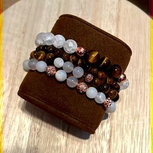 Tigers eye and frosted white beaded bracelets with rose gold metal beads.